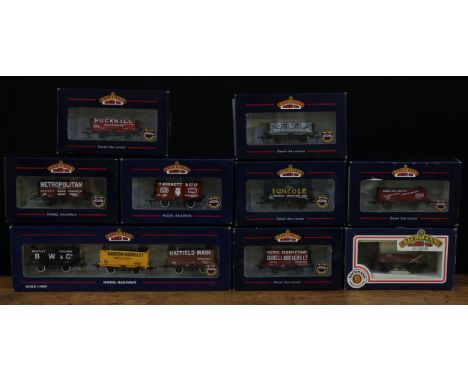 A collection of boxed Bachmann Branch-Line OO Gauge five plank and eight plank wagons, comprising 327-153 'Quibell Brothers',