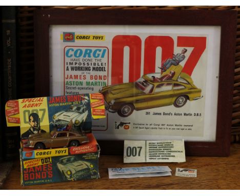 Corgi Toys 261 Special Agent 007 James Bond Aston Martin D.B.5 from the James Bond film "Goldfinger", gold body, red interior