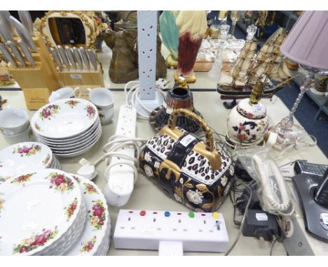 A WHITE PLASTIC TOWER WITH FIVE PLUG SOCKETS; CANDLE TABLE LAMP WITH MIRROR TILED STAND AND SHADE; RESIN MODEL OF HOTEI; POTT