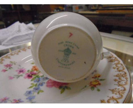 Colclough china, yellow set with pink flowers, 6 cups and saucers, 6 cake plates and a cake serving plate (1 saucer is cracke