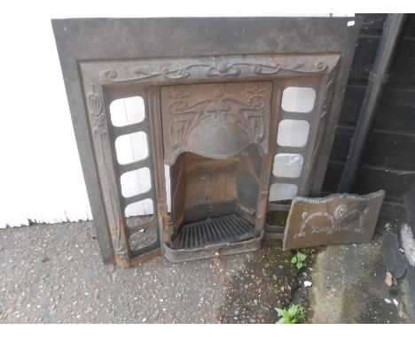 cast iron fireplace with grate etc, spaces for tiles either side