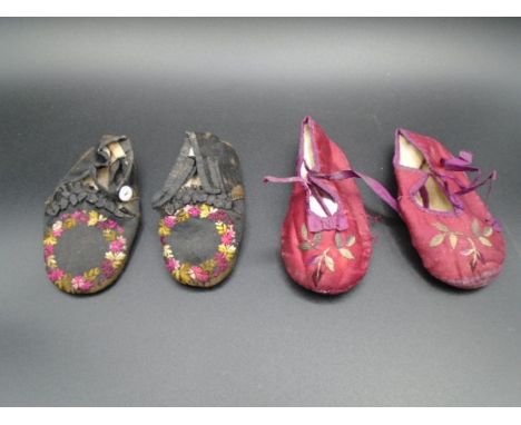Two pairs of mid Victorian handmade silk babies pram/soft shoes, with leather soles and embroidery on the front. one pair has