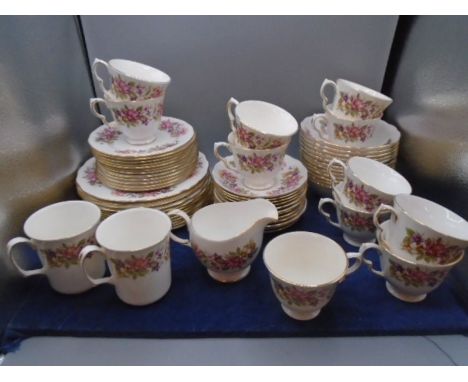 Colclough part tea set, white with honeysuckle design, comprising of 11 cups, 12 saucers, 12 cake plates12 bowls 2 mugs, milk