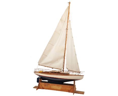 A pleasing model of a single masted ocean going powered motor yacht. A fine plank on frame wooden model (made to sail/run) hu