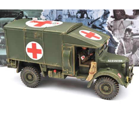 King & Country ‘Wheels & Tracks’ series. Fields of Battle Austin K2 Ambulance with driver (FOB 40). Boxed with packing. Conte