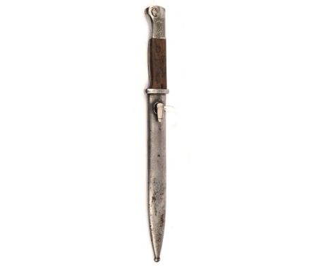 A Third Reich period K98 bayonet,  the unmarked blade etched with panels inscribed “Der Sieg wird unser Sein” and swastika on