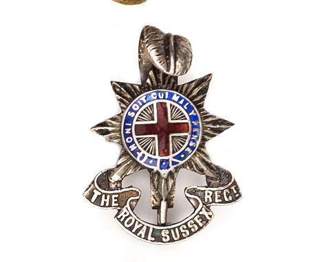 †An officer’s enamelled cap badge of The R Sussex Regt. Near VGC Plate 1                                  
