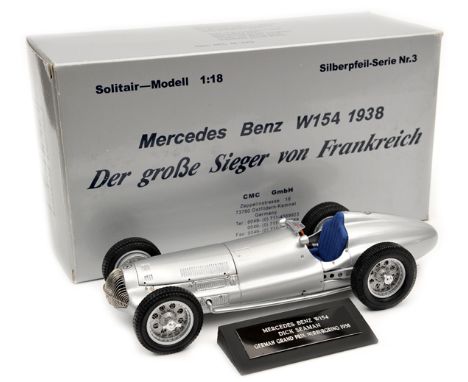 CMC 1:18 scale Mercedes-Benz W154 German Grand Prix, Nurburgring 1938, driven by Dick Seaman. In metallic silver with blue cl