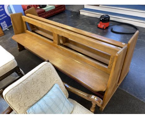 A light oak pew