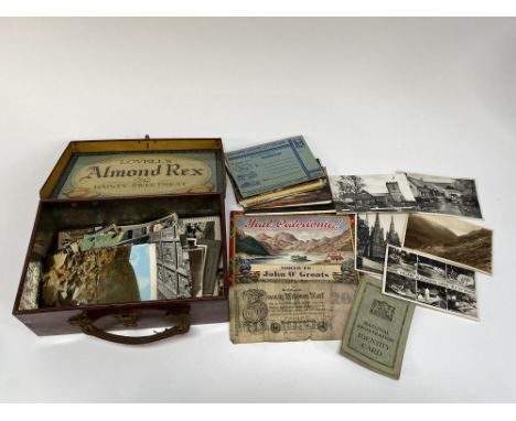 A tinplate briefcase full of postcards