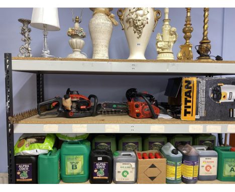Garden tools including mini chainsaw and a hedge trimmer