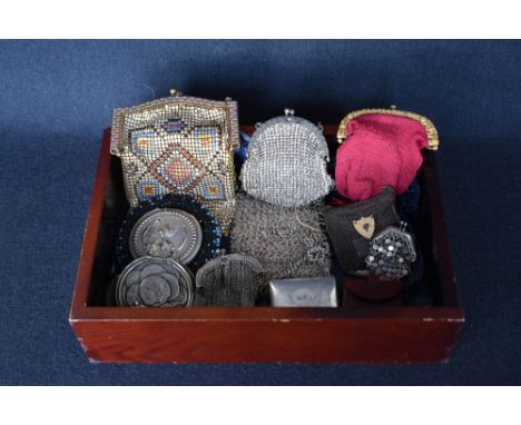 Eleven 19th and 20th century coin purses. Four clasp colure chain mail purses, ranging from 1.5x1.5' to 3.5x6', the largest o