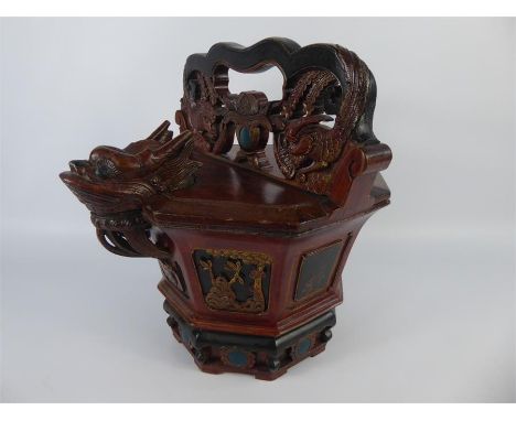 A Chinese 19th Century Wood-Carved Storage Vessel, the cover and handle intricately carved with mythical creatures, the body 