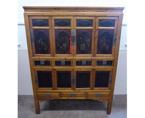 A Chinese Late 19th Century Qing Dynasty Elmwood Storage Cabinet, the cabinet features a central double cupboard to both the 