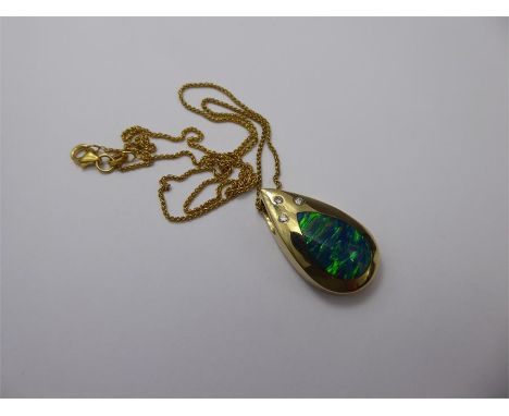 A 14ct Yellow Gold Opal-Effect and Diamond Pendant, approx 6pts dias, suspended on a 14ct gold chain, approx 12.2 gms.