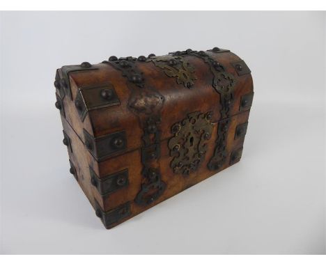 A Victorian Burr Walnut Domed Tea Caddy/Stationary Box with studded brass fittings, approx 23 x 126 cms.