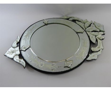 A Cut Glass Venetian Circular Wall Mirror. The mirror having foliate border, the primary mirror approx 45 cms dia, incl borde