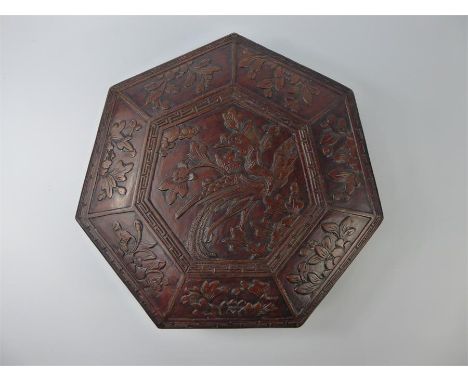 A Chinese Octagonal-Shaped Spice Box, carved with lotus, cloud scroll and phoenix, approx 34 x 9 cms, raised on scroll feet.