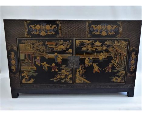 A Chinese Late 19th Century Elm Qing Dynasty Black Lacquer Low Cabinet, with double cupboards,hand-painted in poly-chrome dep