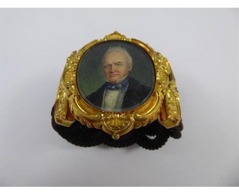 A Late 18th to 19th Century 14ct Yellow Gold Ornate Mourning Portrait Bracelet, the portrait miniature depicting a gentleman 