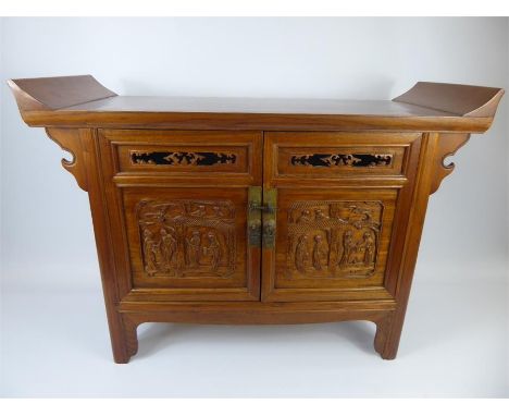 A Chinese 20th Century Elm Low Chest, of altar table design, double cupboard beneath with figural carving in relief, approx 9