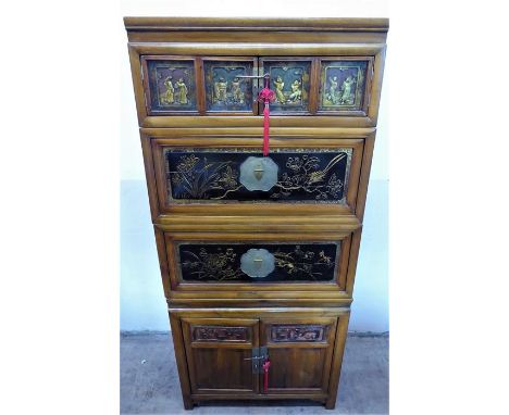 A Chinese Late 19th Century 'Four Seasons' Elm Cabinet, in four parts, with a double cupboard beneath, with two drop front cu