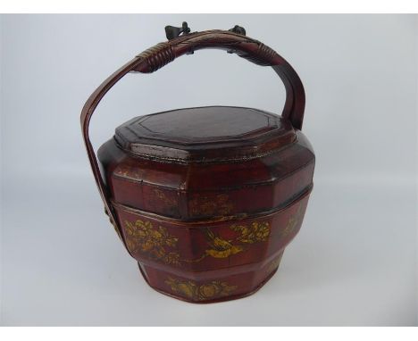 A Chinese Antique Red-Painted Storage Vessel, the cover and body painted with sparrows amongst tree peony, bamboo handle with