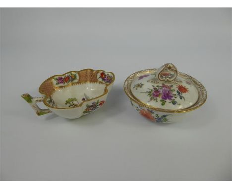 Two Continental Trinket Dishes, the first modelled as a leaf, hand painted with floral spray, the other modelled as a circula