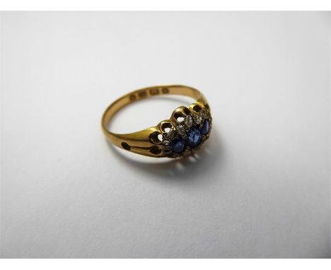 An Antique 18 ct Yellow Gold Sapphire and Diamond Ring, the ring set with sixteen rosecut dias of 10/12 pts, royal blue sapph