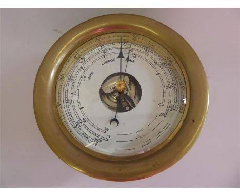 A Brass Cased Ship's Barometer, unmarked, white enamel face, approx 9 x 8 x 8 cms