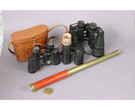 A vintage brass two-draw pocket telescope, 49cm long (open), cased; &amp; two pair of field glasses (one cased).