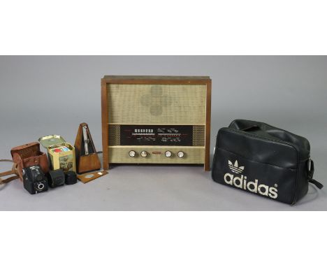 A vintage Maelzel metronome in a mahogany case, 22.5cm high; a vintage Murphy valve radio (Type A.262); &amp; various posters