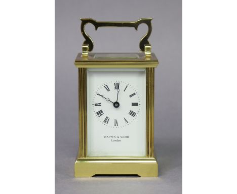 A modern English brass carriage timepiece with fluted corners, the white enamel dial with black roman numerals, inscribed “Ma