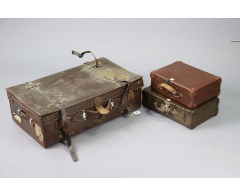 A vintage simulated crocodile skin suitcase, 71.5cm wide; &amp; four small suitcases.