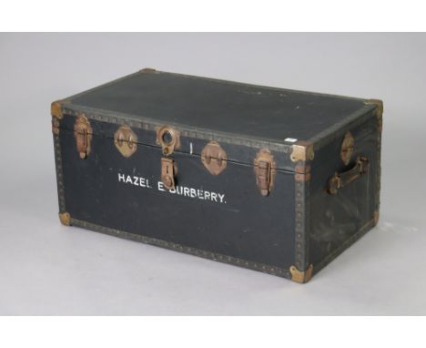 A mid-20th century black fibre-covered travelling trunk with a hinged lift-lid, 92cm wide x 41.5cm high x 51.5cm deep. 