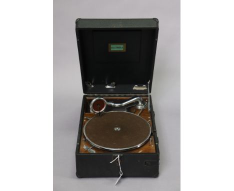 A vintage Electrola portable gramophone in a black fibre-covered case.