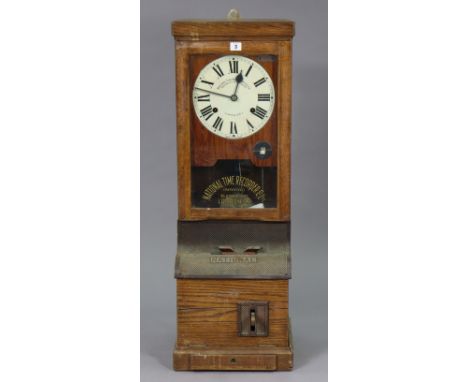 A vintage National time recorder clock in an oak case 34.5cm wide x 98.5cm high.