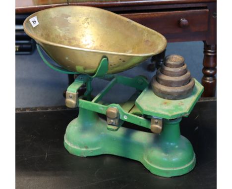 A set of vintage green painted cast-iron counter-top scales with a brass pan &amp; four iron weights. 