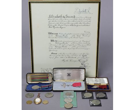 The MBE Badge in silver, with ribbon, cased; the Civil Defence Long Service Medal, cased; an Institute of Fuel past chairman’