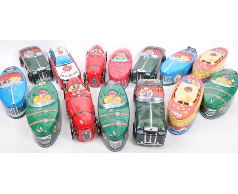A large collection of vintage 20th century &amp; later silver crane car shaped advertisement confectionery tin boxes. The lot