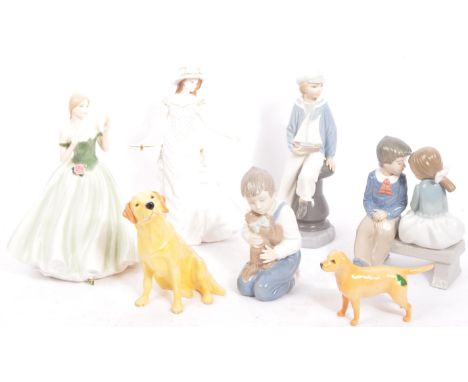 An assortment of vintage 20th century English &amp; Continental fine bone china figurines. the lot to include two Beswick dog