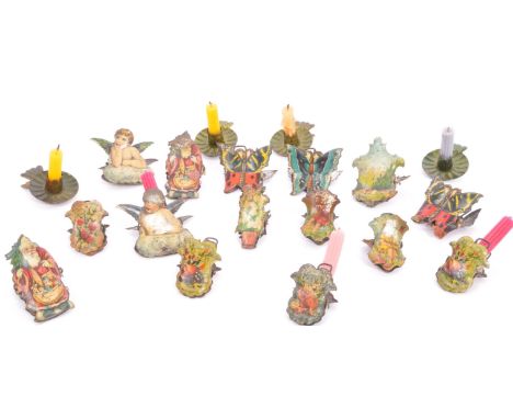 A collection of 19th century Christmas tree tin plate clip candle holders. Each clip having wire work candle holders with the