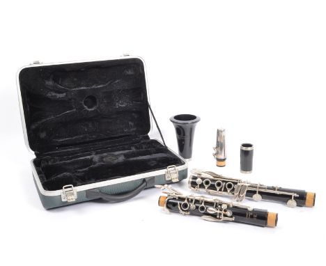 A vintage Besson of London '35' clarinet in plush lined fitted case.
