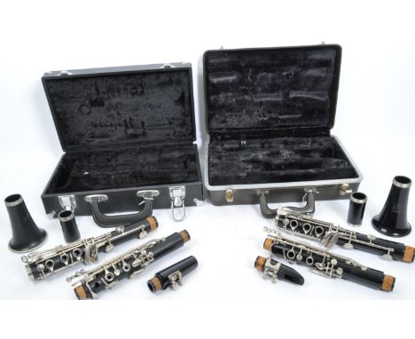 A vintage American made Buescher 'Aristocrat' clarinet in plush lined hard case. Together with another Buescher 'Buz' cased c