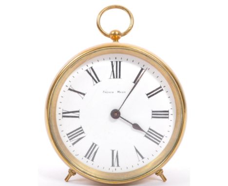 A vintage 20th century French brass cylinder barrel clock. Of circular form with carry hooped handle to top, white enamel fac