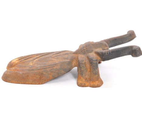 A vintage 20th Century cast iron boot remover in the form of a Beetle. Reg number to the verso Measures approx; 8cm x 26cm.