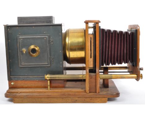 An early 20th century box lantern projector in the manner of Carl Bittman Basel having brass fixtures on a wood frame and lea