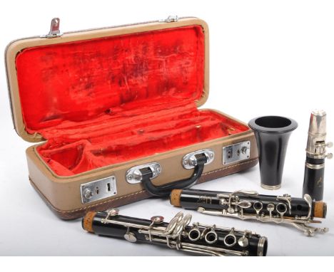 A Boosey &amp; Hawkes 'Regent' ebonised section clarinet in plush lined hard case.