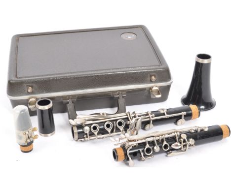 A vintage American made Buescher 'Aristocrat' clarinet in plush lined hard case.