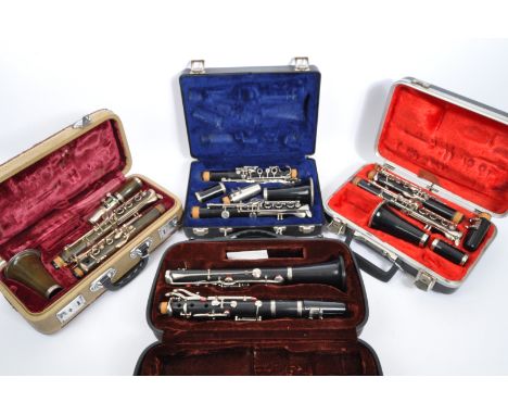 A collection of four vintage clarinets in hard fitted cases. The lot to include a US Prueffer 'Ultima' clarinet, Selmer 'Bund